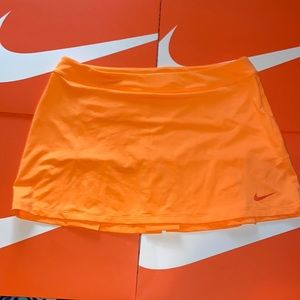 Nike golf Dri~Fit neon orange skirt